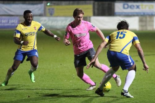 Staines Tyrell Miller-Rodney (L) and Greg Haydon and Enfields Aaron Greene