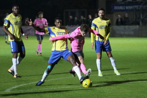 Staines Wadah Ahmidi (yellow) challenges Mickey Parcell