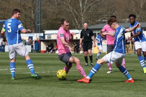 Angels Callum Adonis-Taylor clears from Brad Wadkins (pink)