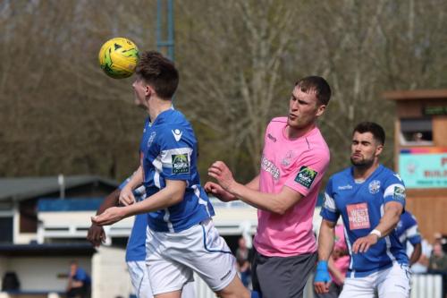 Angels Liam Smith (L) heads clear from Brad Wadkins