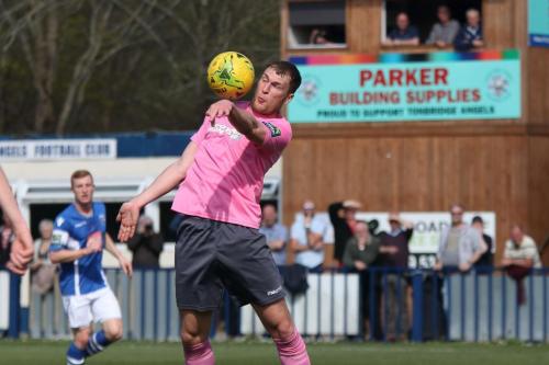 Brad Wadkins chests the ball down