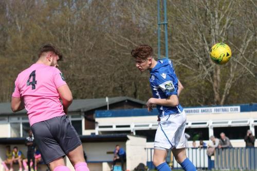 Dan Rumens (L) heads across goal to set up the first Enfiled goal