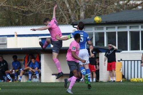 Enfields Brad Wadkins (pink, L) challenges Sonny Miles