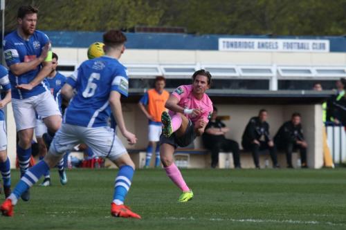 Sam Youngs (R) curls a shot into the top corner to put Enfield 3-1 up