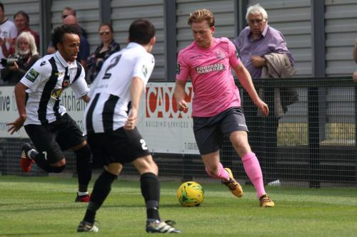 Enfields Aaron Greene and Tootings Ollie Bennett (L) and Dan Clements