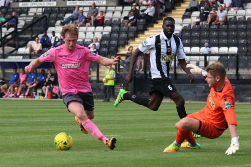 Enfields Aaron Greene rounds keeper Kyle Merson but shoots wide