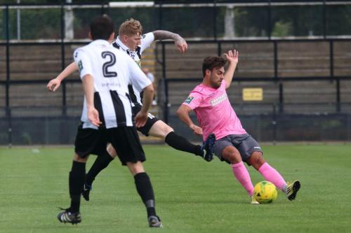 Enfields Jack Higgs (pink) challenged by Billy Dunn