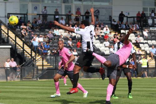 Enfields Rob Bartley (R) heads the opening goal