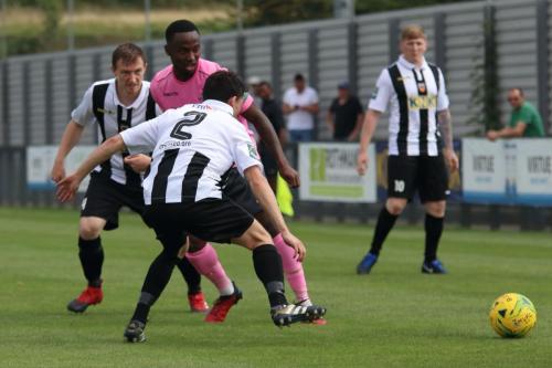 Enfields Ryan Blake challenged by Dan Clements (2)