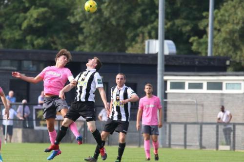 Enfields Sam Youngs (L) wins a header