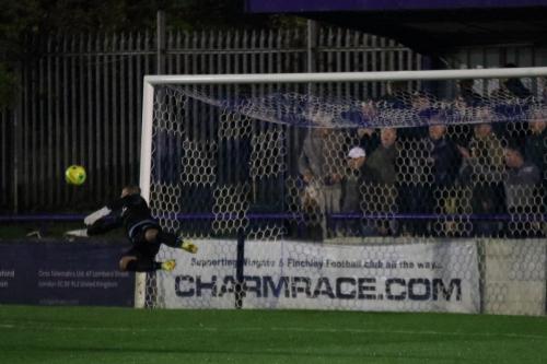 Wingates Shane Gore watches as a late Enfield free kick goes just wide