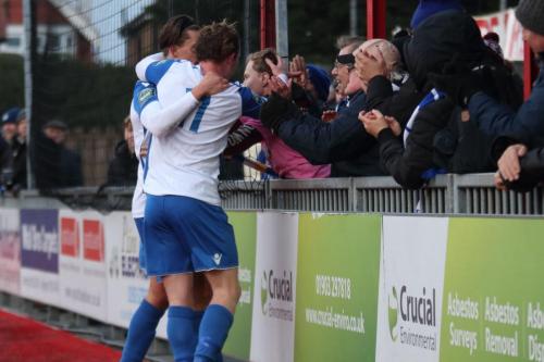 Enfields Aaron Greene (front) celebrates his goal with the travelling supporters