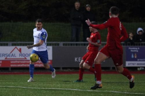 Enfields Craig Calver crosses from the right