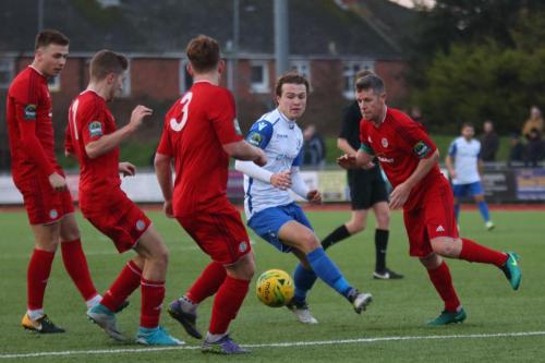 Enfields Mickey Parcell tries to find a way through (L-R) Alfie Young, Harvey Sparks, Sam Rents and Darren Budd