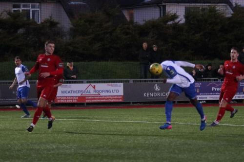 Enfields Ryan Blake cant quite reach Craig Calvers cross