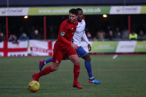 Worthings Alex Parsons (red) and Enfields Ryan Blake