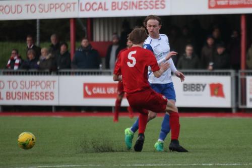 Worthings Joe Clark (red) and Enfields Aaron Greene