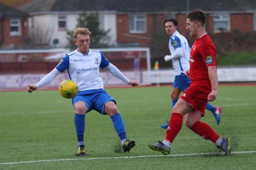 Worthings Sam Rents (red) clears from Ryan Blackman