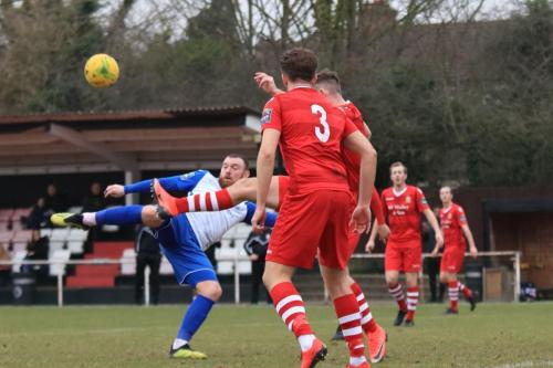 Enfields Billy Bricknell (L) sees his shot blocked