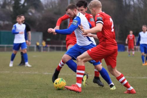 Enfields Billy Bricknell and Hornchurchs Alex Bentley (R) and Joe Christou