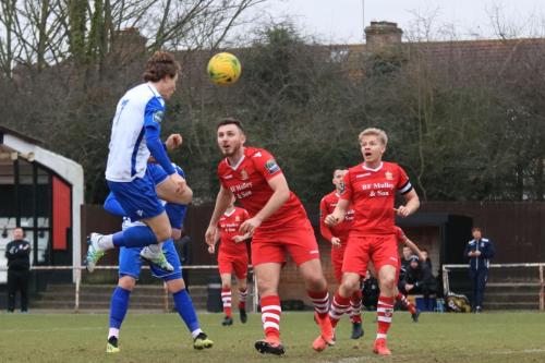 Enfields Mickey Parcell (white) forces a save fron the Hornchurch keeper