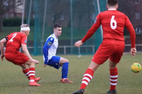 Enfields Sam Chaney and Hornchurchs Alex Bentley (L) and Jordan Clark