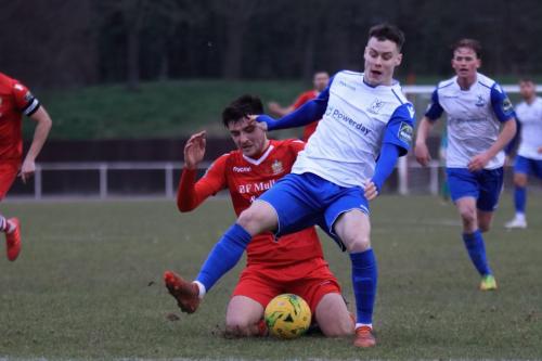 Enfields Sam Chaney and Hornchurchs Joe Christou (red)