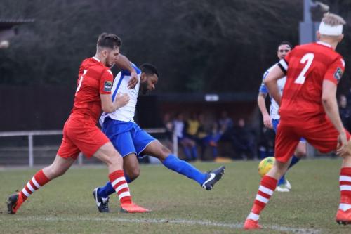 Hornchurchs Kenzer Lee (L) and Alex Bentley and Enfields Kezie Ibe