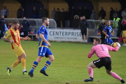 Basingstoke keeper Colm McCadden releases the ball quickly