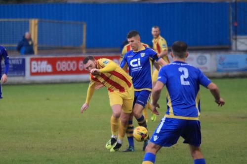 Basingstokes Charlie Kennedy (blue) challenges Billy Bricknell