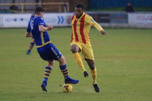 Basingstokes Dan Bayliss (L) and Enfields Taofiq Olomowewe