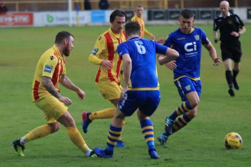 Enfields Billy Bricknell (L) and Sam Youngs and Basingstokes Dan Bayliss (6) and Charlie Kennedy
