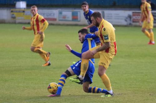 Enfields Billy Bricknell (R) challenges Sam Deadfield