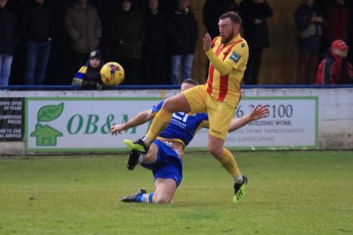 Enfields Billy Bricknell (yellow) and Basingstokes Robert Gerrard
