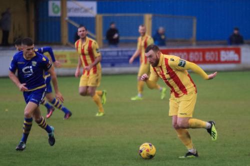 Enfields Billy Bricknell runs at the defence