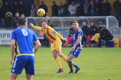 Enfields Sam Youngs (yellow) shoots from long range