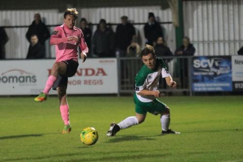 Aaron Greenes shot deflects off the heel of Bognors Calvin Davies (R)