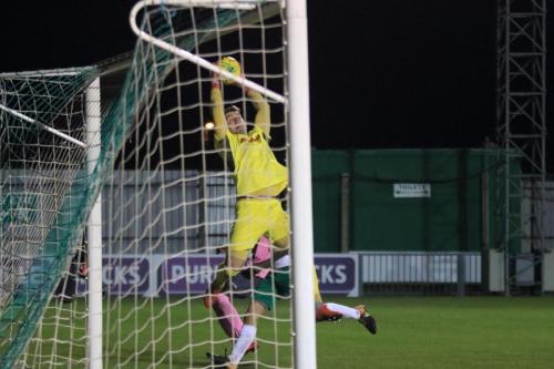 Bognor keeper Dan Lincoln back-pedals to collect a cross