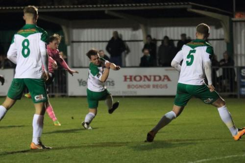 Bognors Calvin Davies (centre) blocks Aaron Greenes shot