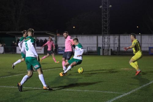 Bognors Chad Field (2nd R) blocks Billy Bricknells shot