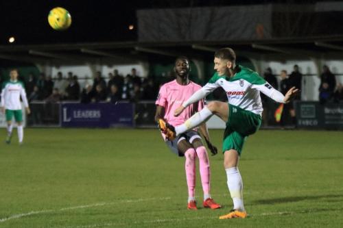 Bognors Chad Field (R) clears from Muhammadu Faal