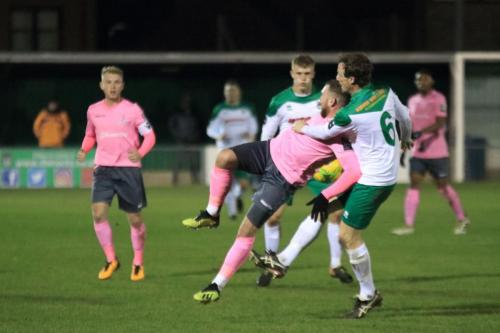 Bognors Gary Charman (6) challenges Billy Bricknell
