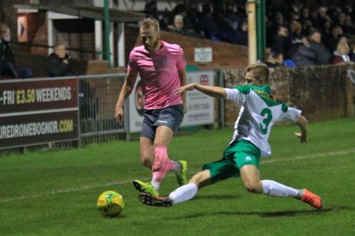 Bognors Joe Tomlinson (R) tackles Sam Hatton