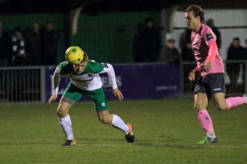 Bognors Tommy Block (L) heads back to his keeper under pressure from Mickey Parcell