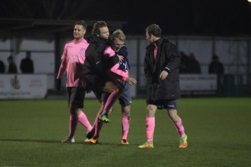 Mickey Parcell (2nd L) congratulates match winner Ryan Blackman at the final whistle