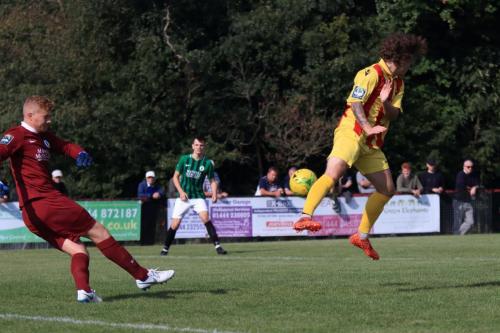 Burgess Hill keeper Josh James beats Sam Chaneys attempted charge-down