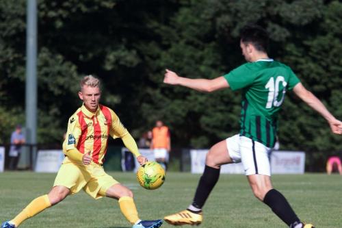 Burgess Hills Connor Tighe (R) clears from Ryan Blackman