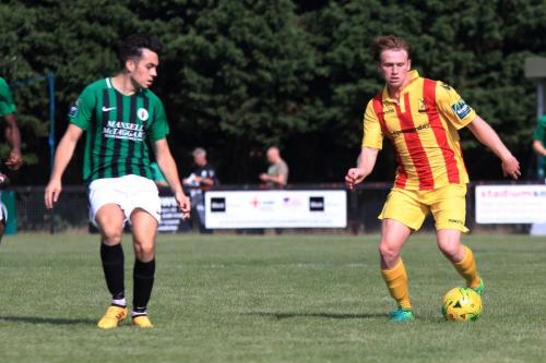 Burgess Hills Conor Tighe (L) and Enfields Aaron Greene