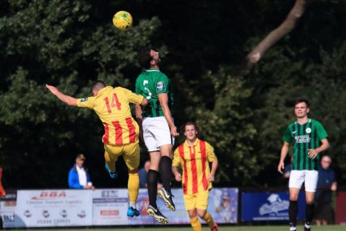 Burgess Hills Gary Elphick (green) wins a challenge with Brandon Adams