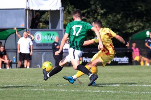 Enfields Brandon Adams shoots as Charlie Bennett tries to block